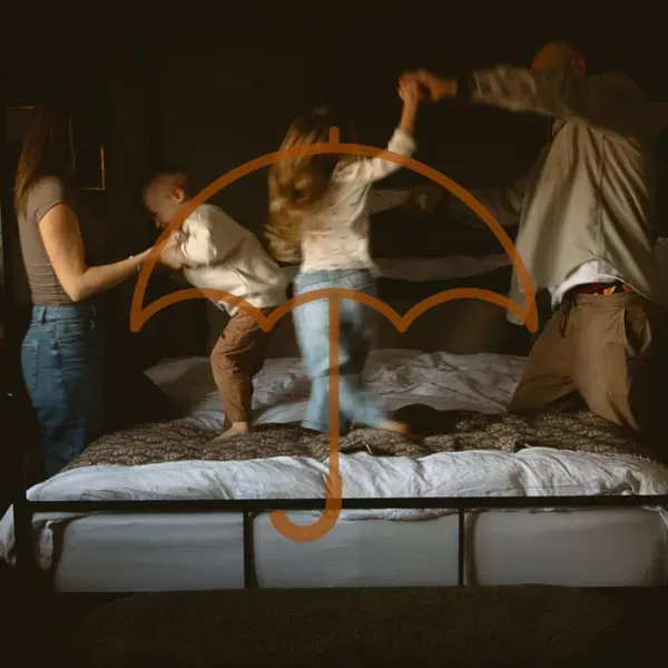 Children jumping on a bed
